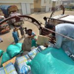 Labours are loading relief items in a truck that would be send to affectees of Jaranwala incident by Secretary Auqaf, Hajj, Religious & Minority Affairs KP Dr. Asad Ali Khan