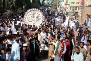 A large number of people participating in a religious procession on the occasion of Eid Milad-ul-Nabi (PBUH)