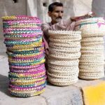 A vendor displaying handmade baskets to attract the customers at VIP Road
