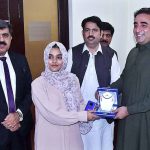 Chairman PPP, Bilawal Bhutto Zardari giving a shield to the winner students of the Speech competition titled International Responsibilities of Pakistan during his visit to the University.