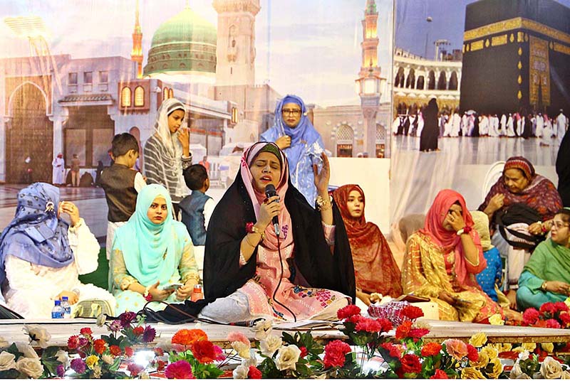 Woman Naat Khawan is reciting a Naat during Mehfil-e-Milad in Holy month of Rabi-ul-Awwal at Latifabad