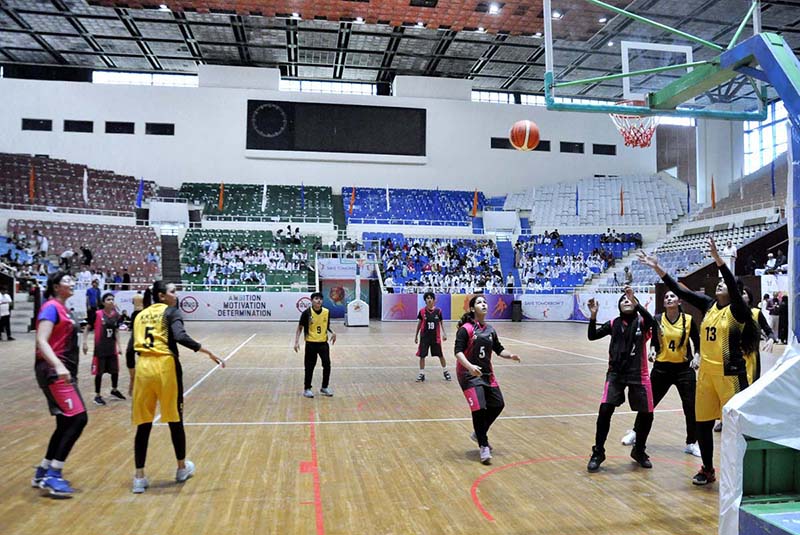 Women team players competing during the 7-Basketball Game Day 2023 at Liaquat Gymnasium, Pakistan Sports Complex.