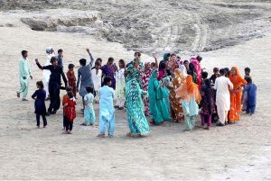 A large number of Hindu community members are joyfully celebrating the Ramakrishna festival on the banks of the Indus River