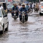Vehicular traffic face problem in movement due to stagnant water on the road at Saddar area after rain in the Provincial Capital
