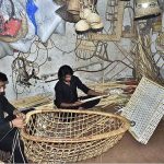 Workers making bamboo swings near Bhatti Gate