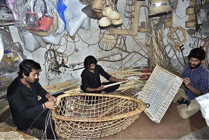 Workers making bamboo swings near Bhatti Gate