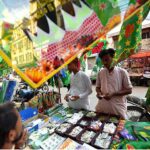 Buntings, flags, badges and souvenirs are displayed at the roadside stalls in connection with 12th Rabi-ul-Awwal at Paper Market