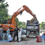 Machinery being used for extension work of Park Road during development work in Federal Capital
