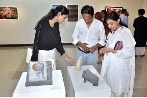 Visitors keenly viewing stuff during the inaugurating ceremony of the Two Person Exhibition titled "HAQ" organized by PNCA & Nomad Gallery at PNCA.