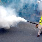 Disinfected spray being carried out by District Health Office (DHO) officials at Karachi Press Club.