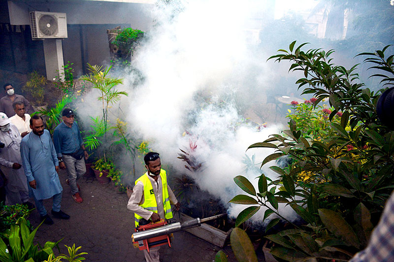 Disinfected spray being carried out by District Health Office (DHO) officials at Karachi Press Club.