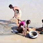Fishermen catching the fishes in traditional way at Rice Canal