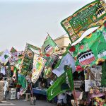 People busy in purchasing flags in preparation of Eid Milad-un-Nabi (PBUH) celebrations.
