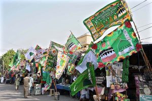 People busy in purchasing flags in preparation of Eid Milad-un-Nabi (PBUH) celebrations.