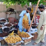 Vendor selling verities of dates on roadside