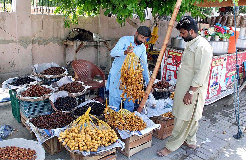 Vendor selling verities of dates on roadside