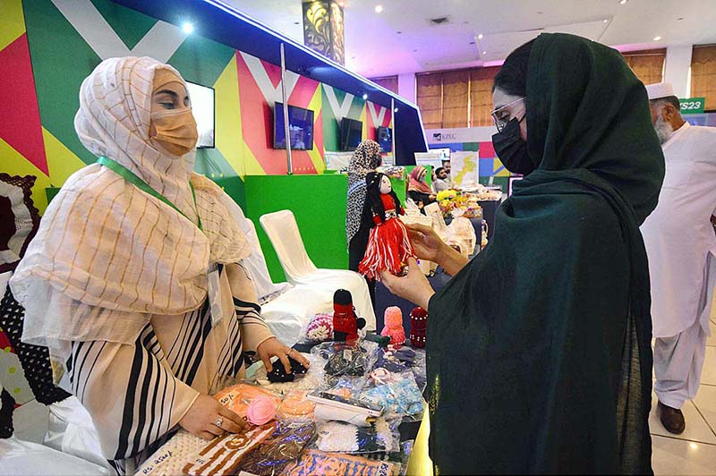 Female visitors taking interest in displayed stuff during Rural Youth Summit 2023 Digital Solution for Rural Youth
