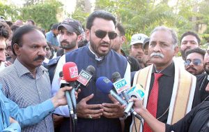 Caretaker Federal Minister for Human Rights Khalil George talking to media person on his arrival