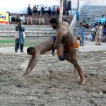 Wrestlers in action during Rustam Dangal at the District Sports complex