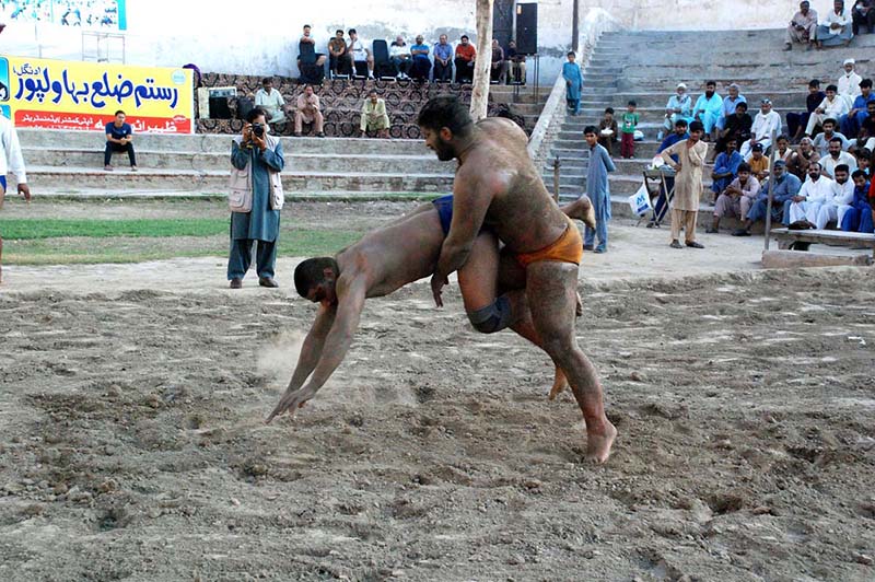 Wrestlers in action during Rustam Dangal at the District Sports complex
