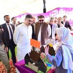 Caretaker Prime Minister Anwaar-ul-Haq Kakar interacts with school students at the display stalls of various science, technology and artistic projects at Chief Minister Secretariat