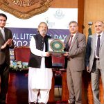 Vice Chancellor Allama Iqbal Open University Professor Dr. Nasir Mahmood presents a souvenir to Caretaker Federal Minister for Education and Professional Training, Madad Ali Sindhi on "Literacy Day"
