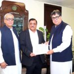 Federal Minister for Privatisation Fawad Hasan Fawad, Handing over a mutation Deed of FBR land situated at Faisalabad to the successful buyer