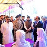 Caretaker Prime Minister Anwaar-ul-Haq Kakar interacts with school students at the display stalls of various science, technology and artistic projects at Chief Minister Secretariat