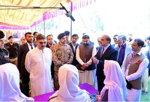 Caretaker Prime Minister Anwaar-ul-Haq Kakar interacts with school students at the display stalls of various science, technology and artistic projects at Chief Minister Secretariat
