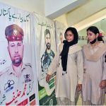 Students are viewing photo exhibition of martyrs on occasion of Defence Day held at Sargodha Arts Council