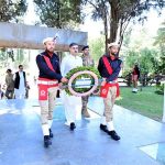 Caretaker Prime Minister Anwaar-ul-Haq Kakar lays down a floral wreath on the Yadgaar-e-Shuhada