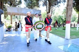 Caretaker Prime Minister Anwaar-ul-Haq Kakar lays down a floral wreath on the Yadgaar-e-Shuhada
