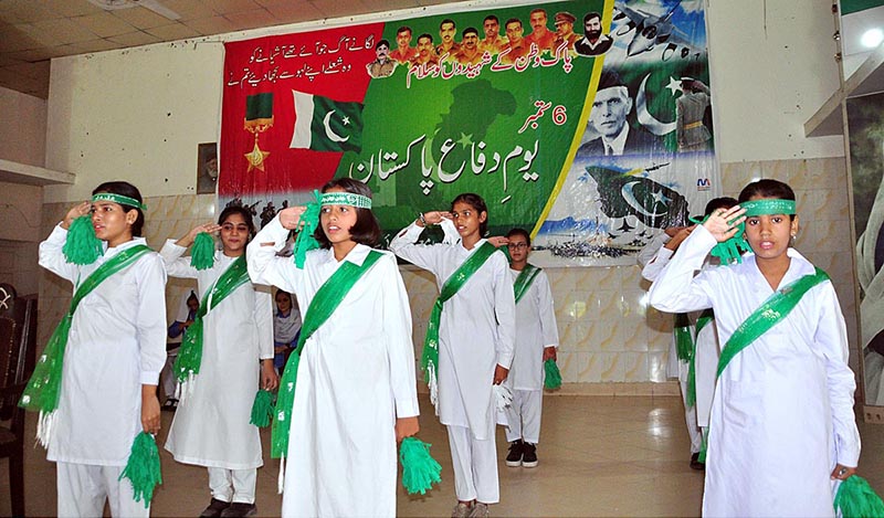 Students are viewing photo exhibition of martyrs on occasion of Defence Day held at Sargodha Arts Council