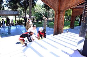 Caretaker Prime Minister Anwaar-ul-Haq Kakar lays down a floral wreath on the Yadgaar-e-Shuhada
