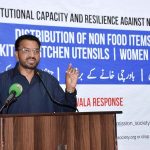 Caretaker Federal Minister for Human Rights and Women Empowerment, Khalil George, addressing the distribution ceremony of non food items to the Christian community in Jaranwala