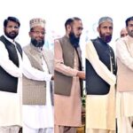 President Dr Arif Alvi distributing prizes among the position holders of the National Competition of Seerat and Naat Books, at the concluding session of the Seerat-un-Nabi (PBUH) Conference