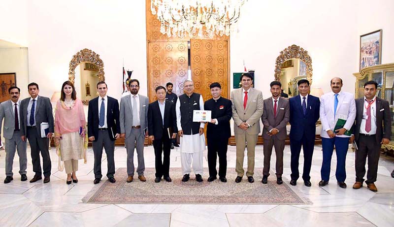 President Dr. Arif Alvi in a group photo with a delegation of Tang Chinese International Education and Technology (Pvt) Ltd led by Mr. Song Jianying, which called on him, at Aiwan-e-Sadr.
