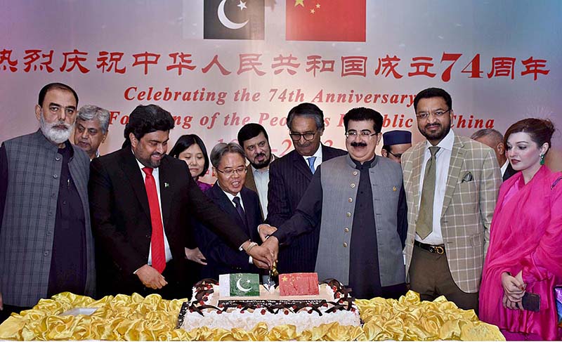 Chairman Senate Sadiq Sanjrani and Ambassador of the People’s Republic of China Jiang Zaidong are cutting cake along with other officials on the occasion of the 74th Anniversary of the Founding of the People’s Republic of China