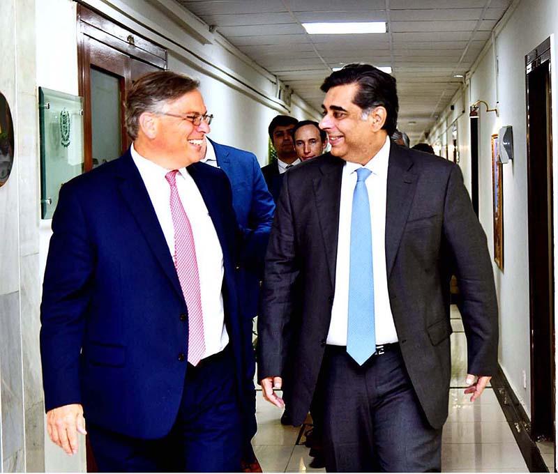 Dr. Gohar Ejaz, Federal Minister for Commerce, Industries, and Production, and American Ambassador Donald Blome share a pleasant moment following a productive meeting at the Ministry of Commerce