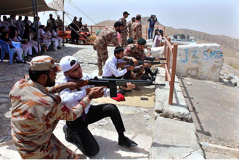 Teachers and Students of Govt Elementary College Jinnah Town Quetta experiencing gunshot at Shooting Range Quetta during their visit on the occasion of Defence Day