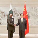 Federal Minister for Interior Sarfraz Ahmed Bugti shaking hands with Chinese State Councillor and Minister for Public Security Wang Xiao Hong