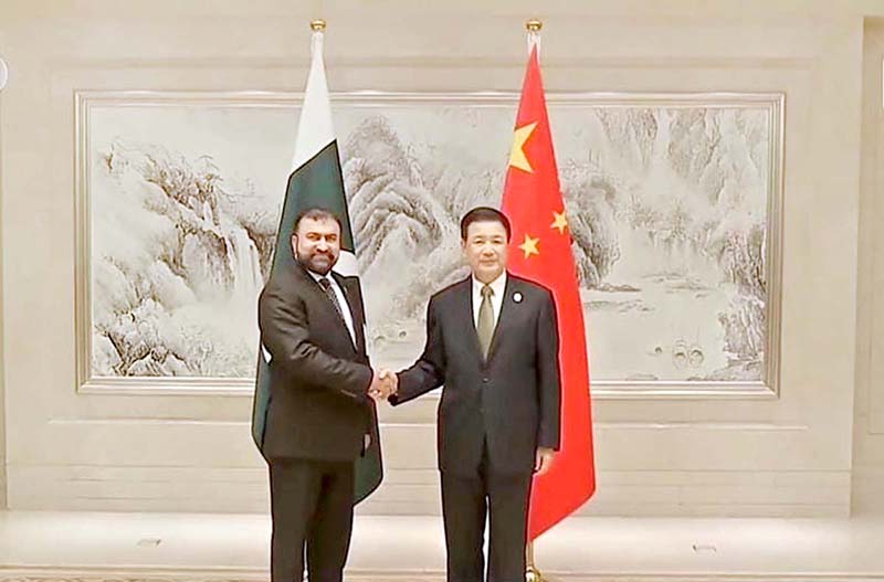 Federal Minister for Interior Sarfraz Ahmed Bugti shaking hands with Chinese State Councillor and Minister for Public Security Wang Xiao Hong