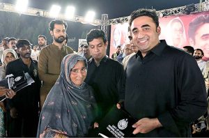 Chairman Pakistan People's Party Bilawal Bhutto Zardari distributing land ownership rights papers to Sukkur Barrage and Canals affectees from Bashirabad and Raju Marwari Goth