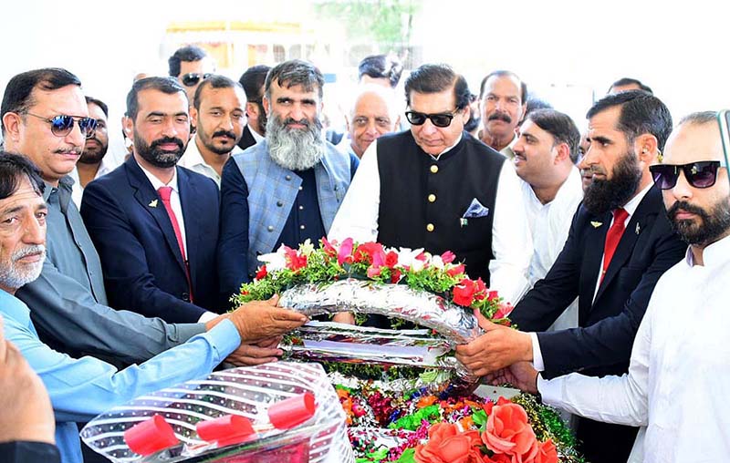 Speaker National Assembly Raja Pervez Ashraf offering Fateha at the grave of Captain Raja Muhammad Sarwar Shaheed Nishan-e-Haider in-connection with Defence Day in Singhori Village