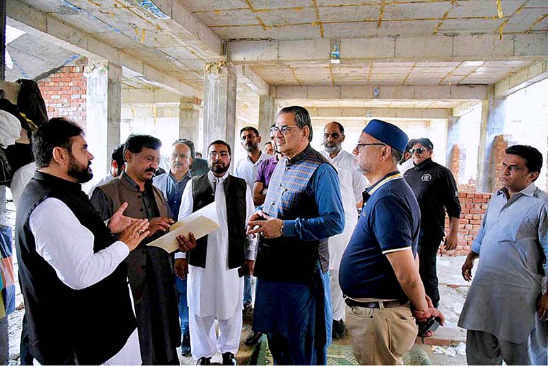 Caretaker Federal Minister for Religious Affairs and Interfaith Harmony Aneeq Ahmed is being briefed during his visit to new Hajji Camp