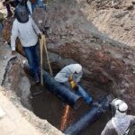 SNGPL staffers busy in laying sui gas pipeline at Jaranwala Road.