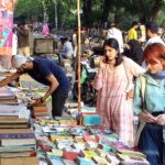 People busy in selecting and purchasing old books from roadside setup in Provincial Capital