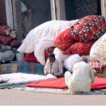 Workers are busy stitching quilts at their workplace as demand increases in winter season