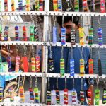 A vendor displaying and selling key rings at Jinnah Bagh Chowk.