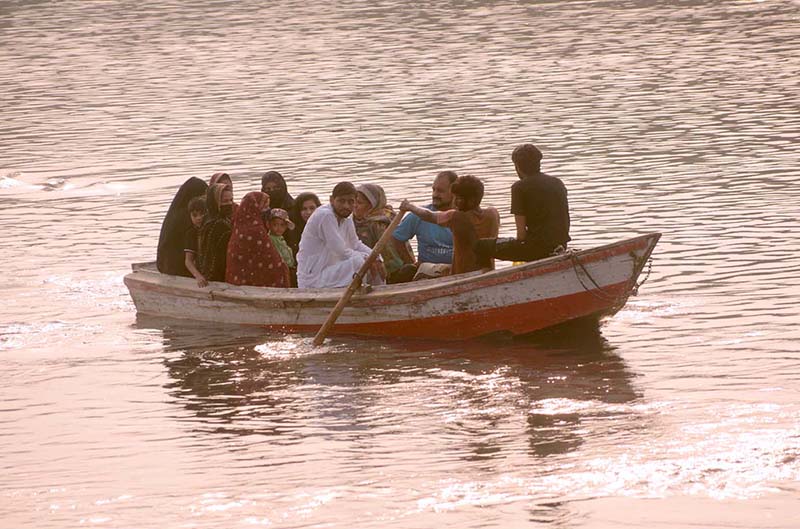 Tourists enjoying boat ride in River Ravi during evening time in Provincial Capital